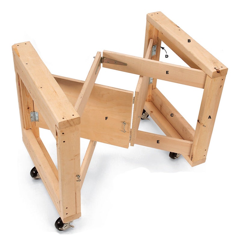 May include: A wooden folding workbench with four wheels and a hinged door. The workbench is made of natural wood and has a simple design. The workbench is labeled with letters A through F.