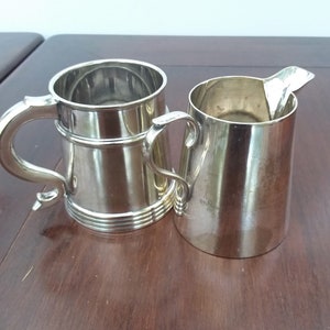 Silver jug and tankard, bar ware, silver plated EPNS  glass bottom tankard, the jug is  Charles S. Green & Co Cogent Plate.