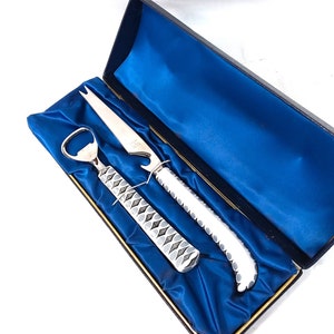 Coalport china Bar ware, bottle opener and cheese knife, Coalport black and white with china handles, in original presentation box.