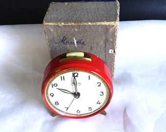Mauthe clock, Colibri alarm clock, working, 1930s to 1940s wind up little red alarm clock, with original box and a sales receipt.