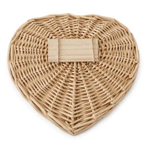 May include: A heart-shaped woven wicker basket with a light tan natural finish. The basket features a rectangular wooden plaque attached to the center of the weave, providing a flat surface for labeling or personalization within the design.