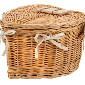 May include: A heart-shaped wicker basket with a lid and white fabric ties. The lid has a wooden handle.