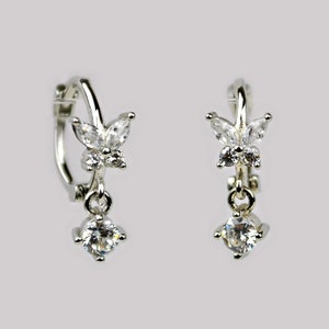Flower huggie hoop earrings. Sterling silver cartilage hoop earrings. Tiny butterfly hoop earrings. Dainty cubic zirconia charm hoop earring
