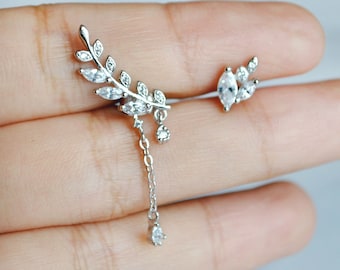 Mismatched silver leaf earrings. Asymmetric cubic zirconia drop earring. Dainty sterling silver stud earring. Boho wedding statement earring