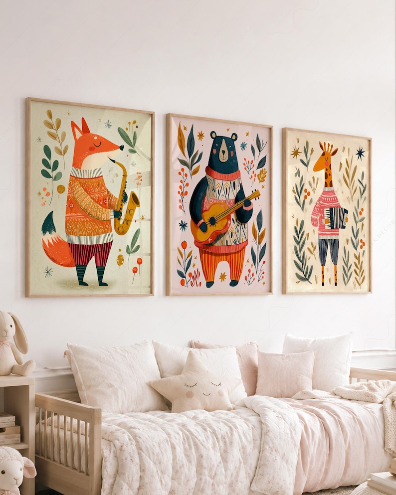May include: Three framed wall art prints featuring anthropomorphic animals playing musical instruments. A fox plays a saxophone, a bear plays an acoustic guitar, and a giraffe plays an accordion. Each animal wears a patterned sweater and is surrounded by foliage.