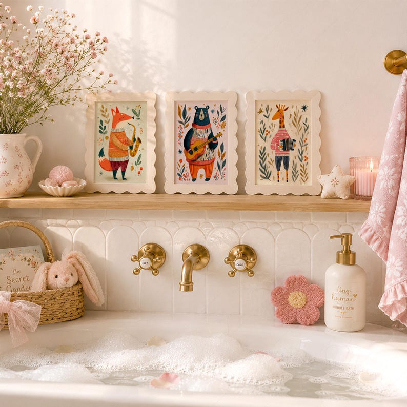 May include: Three rectangular scalloped-edge frames featuring illustrations of a fox playing a saxophone, a bear playing a guitar, and a giraffe playing an accordion. The frames are displayed on a wooden shelf above a white bathtub filled with bubbles.
