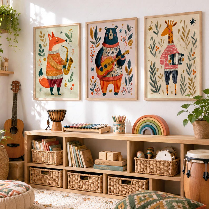 May include: Three framed wall art prints featuring a fox playing a saxophone, a bear playing a guitar, and a giraffe playing an accordion, all surrounded by botanical illustrations in warm tones, displayed above a wooden toy storage unit.