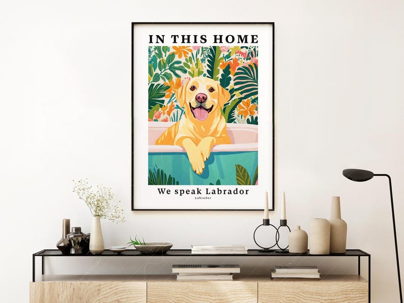 May include: A colorful illustration of a yellow Labrador Retriever sitting in a bathtub with green and white floral accents. The text "In this home we speak Labrador" is printed below the image.