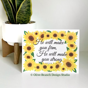 May include: A white card with a sunflower border and the text "He will make you firm, He will make you strong. 1 Peter 5:10" in black. The card also has the text "Olive Branch Design Studio" in the bottom right corner.