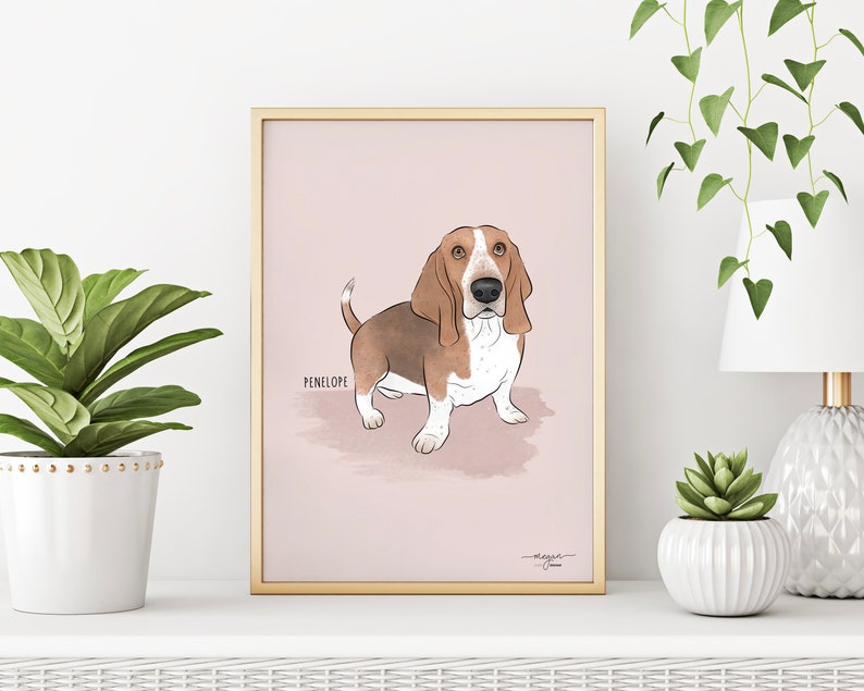 A framed illustrated printed portrait of a basset dog on a pink background.