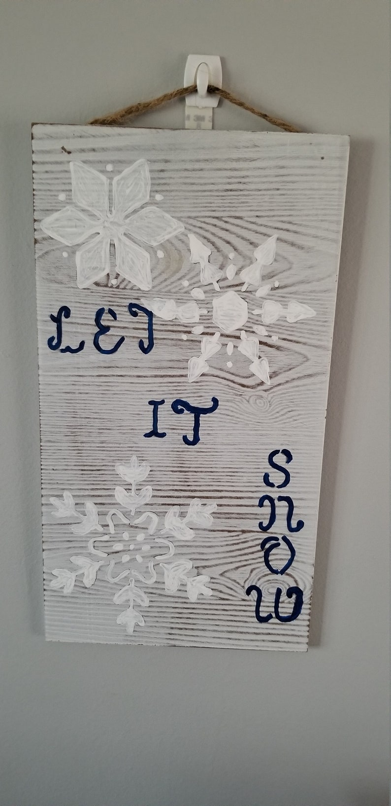 Must have. Great gift or decor for winter holidays size 4x12x18 On whitewash board stenciled with large snowflakes Sign Let It Snow