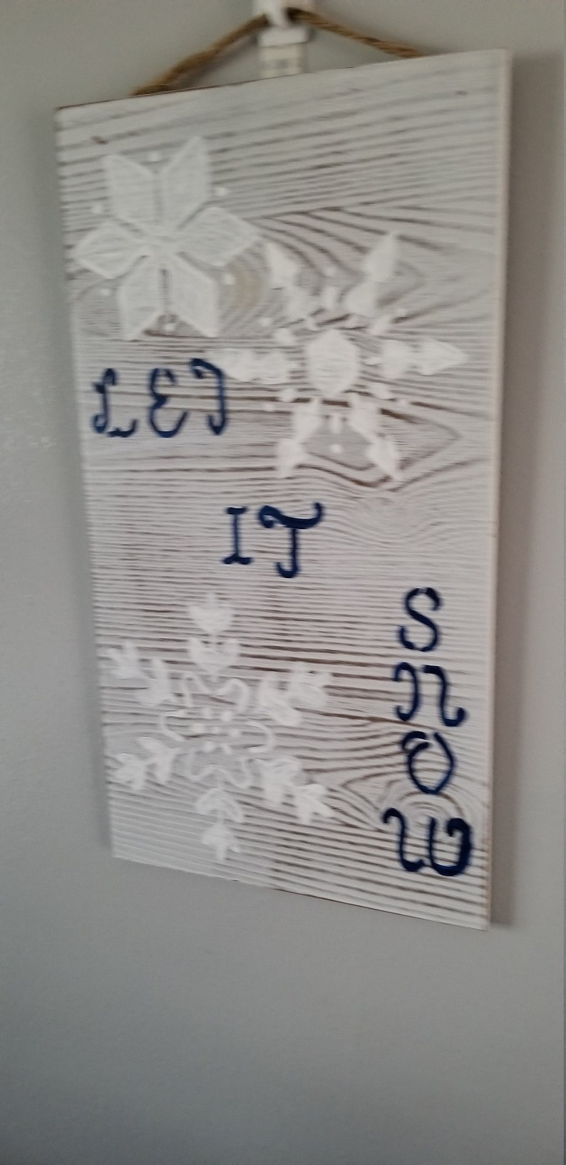 Must have. Great gift or decor for winter holidays size 4x12x18 On whitewash board stenciled with large snowflakes Sign Let It Snow