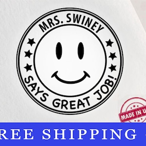 May include: A black and white stamp with a smiley face design. The stamp reads "MRS. SWINEY SAYS GREAT JOB!" in a circular pattern around the smiley face. A small "MADE IN USA" stamp is visible.