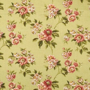 May include: Floral fabric with a repeating pattern of pink and white flowers and green leaves on a light green background. The flowers are a mix of roses and daisies, creating a vintage aesthetic.