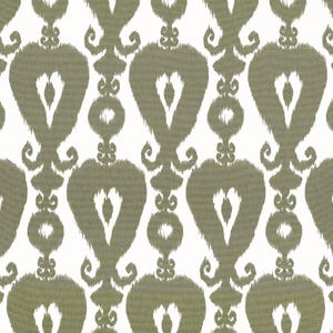May include: A repeating pattern of olive green and white. The design features large, stylized heart shapes with a central teardrop detail, connected by smaller circular and scroll-like elements. The fabric has a textured, slightly blurred appearance.
