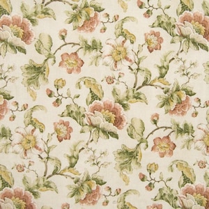 May include: A beige fabric with a repeating floral pattern. The flowers are pink, white, and yellow with green leaves.