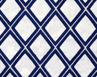 May include: White fabric with a repeating diamond pattern embroidered in navy blue thread. The diamonds are outlined with a thin white thread, creating a textured, geometric design. The fabric appears to be linen or a similar natural fiber.