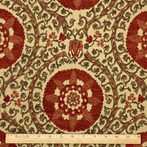 May include: Red and cream fabric with a repeating pattern of stylized flowers and leaves. The fabric has a textured, almost velvet-like appearance.