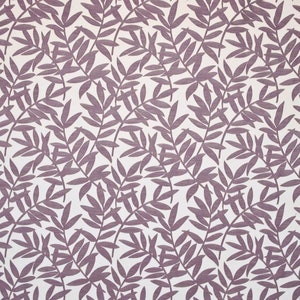 May include: A white fabric with a repeating pattern of purple leafy branches. The branches are stylized and have a simple design.