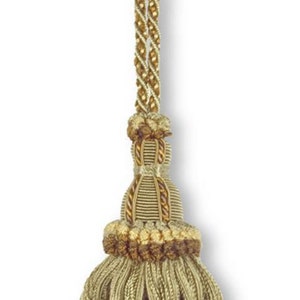 May include: A green and brown tassel with a gold cord. The tassel has a multi-layered design with a fringe at the bottom.