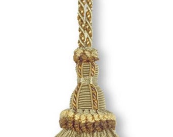 May include: A green and brown tassel with a gold cord. The tassel has a multi-layered design with a fringe at the bottom.