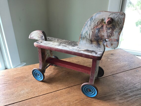 antique riding horse on wheels