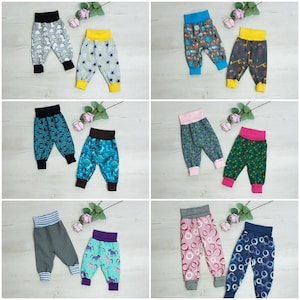 May include: Ten pairs of colourful baby leggings with various patterns, including dinosaurs, stars, and geometric shapes. The leggings are made of soft, stretchy fabric and are perfect for everyday wear.