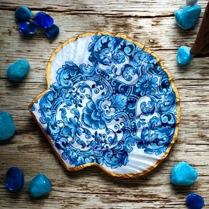 One off designs, extremely limited edition Oyster Shells and scallop shells sealed with gloss varnish and gold edged