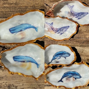 Handcrafted whale  Oyster Shells (various designs) sealed with gloss varnish, drilled and hung with organic twine. coastal decor