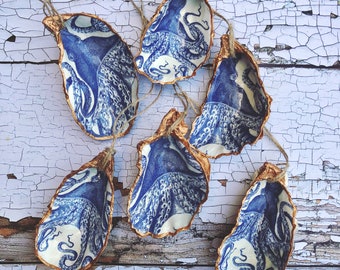 Decoupage Oyster Shell (various designs) edged with copper paint and drilled with hanging organic twine