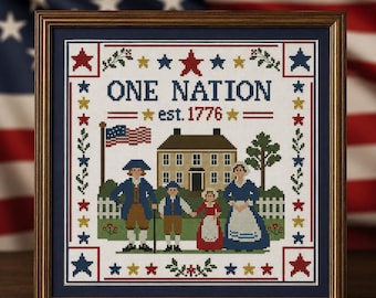 May include: Framed cross-stitch art with a patriotic theme. The design features a family, a house, and the text "ONE NATION est. 1776" surrounded by stars and floral elements. The frame is a dark wood color.