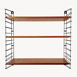 May include: A three-tiered wall shelf unit. The shelves are made of wood with a warm brown finish. The supporting structure is black metal, featuring a grid-like design. The unit is designed for storage and display.