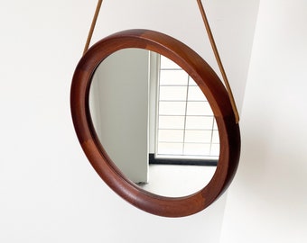 Mid Century solid teak wall mirror with a leather strap - Danish design