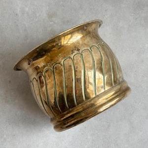 May include: A set of three ceramic mugs with a speckled, matte finish in cream, light grey, and dark grey. Each mug has a simple, minimalist design, suitable for coffee or tea.