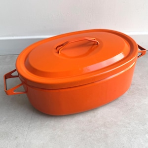 May include: A white ceramic mug with a black handle and the text "But First, Coffee" in a handwritten style. The mug is on a white surface. The mug is approximately 4 inches tall.