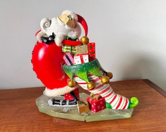 Vintage Christmas Santa figurine with stocking and gifts