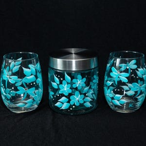 3 Piece Gift Set, beautiful teal flowers and dragonflies, with gemstones added, 2 glass stemless wine glasses, 1 glass storage container/lid