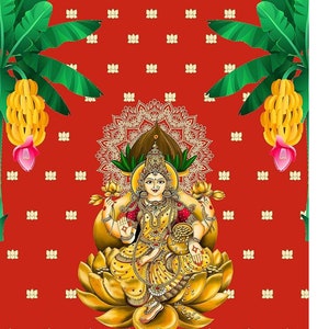 May include: A red background with a white floral pattern. A golden goddess figure sits on a lotus flower. The goddess is wearing a yellow and red sari and holding a pot of gold. Two banana plants with green leaves and yellow bananas are on either side of the goddess.