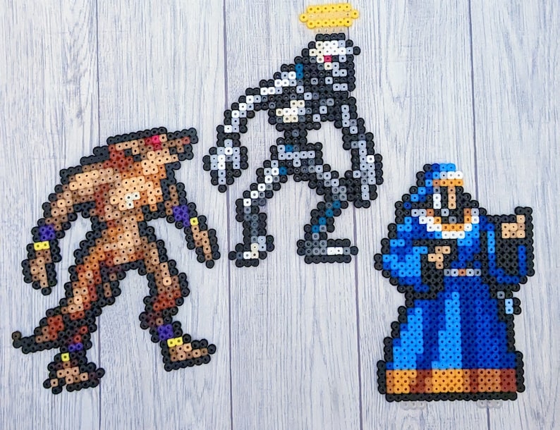 May include: Three pixel art figures made of colourful beads. A brown werewolf-like figure stands on the left, a grey robot-like figure with a halo stands in the centre, and a blue robed figure stands on the right.
