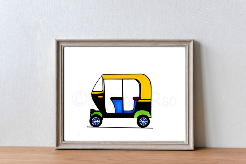 May include: A framed illustration of a colorful auto rickshaw. The vehicle is depicted with a yellow roof, black body, blue seats, and green and blue wheels. The artwork is set against a white background.