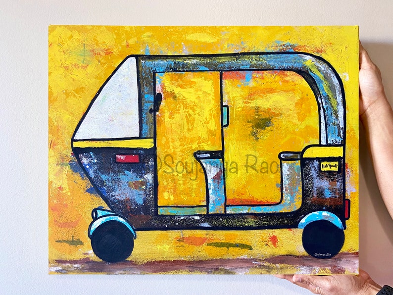 May include: Abstract painting of a yellow, black, and blue auto-rickshaw. The artwork features a textured background and bold outlines, with the artist's signature in the lower right corner. The vehicle has a white roof and blue accents.