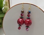 Red earrings. Sparkly colorful earrings. Cherry red. Mettalic earrings. Hematite. Hexagon. Peacock earrings. Statement. Painted beads