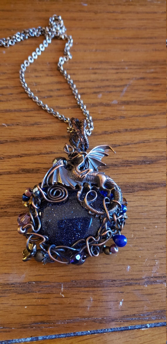 Blue goldstone wire wrapped pendant