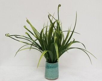 Faux curly grass, Potted in a speckled clay pot, Glazed in a Turquoise blue glaze.
