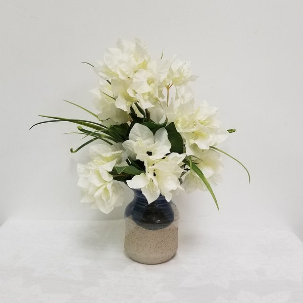 Faux White Bougainvillea blooms with curly grass, potted in a Handmade clay vase, Glazed in shades of blue and clear glaze.