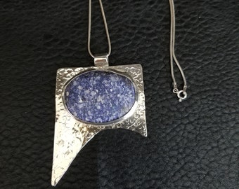 Blue Lapis Lazuli stone pendent, Artisan made, and set on sterling silver, with a sterling silver chain.