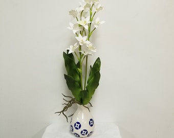 Faux white Dendrobium orchid plant, Potted in a Blue and White glazed bud vase.