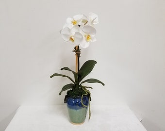 White Faux Phalaenopsis Orchid plant by 6 blooms, Potted in a ceramic vase glazed Blue and Turquoise .