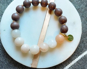 Pink opal stone bracelet: semi-precious stone beads with wood and gold accent beads.