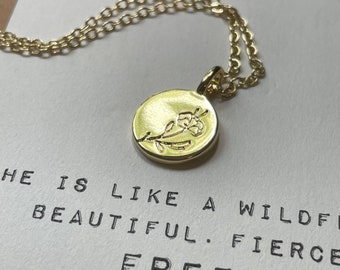 Micro affirmation: Flower-stamped gold charm necklace with message of hope.